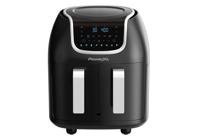 A black air fryer has two handles for double baskets.
