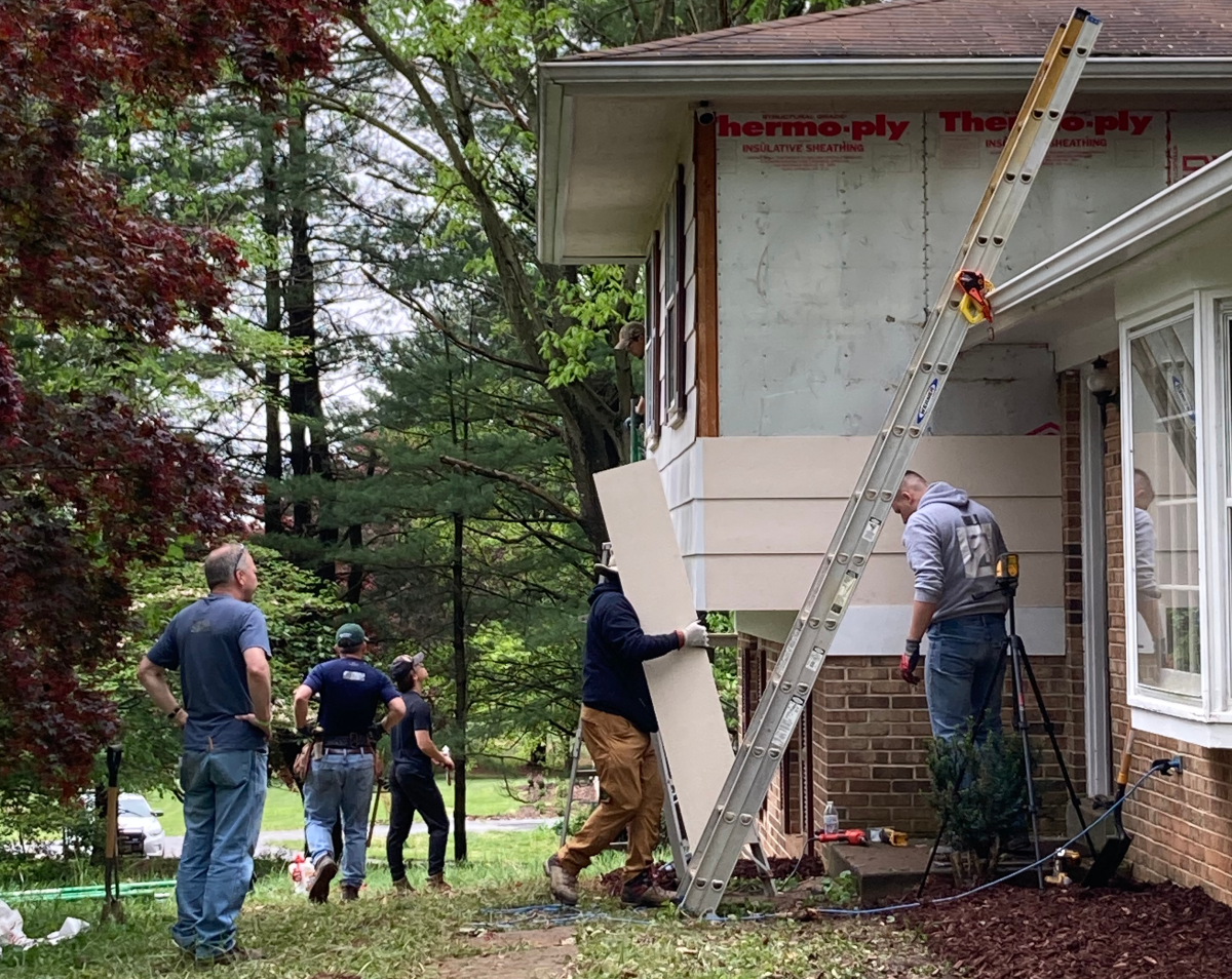 Volunteers work on repairing a home in Maryland.