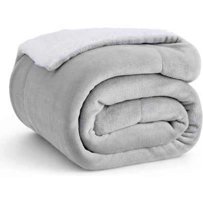 The Bedsure Sherpa and Fleece Reversible Blanket folded on a white background.