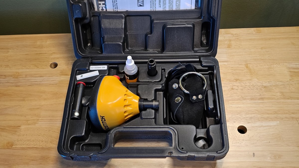 The Bostitch PN100K Palm Nailer and accessories in its case.