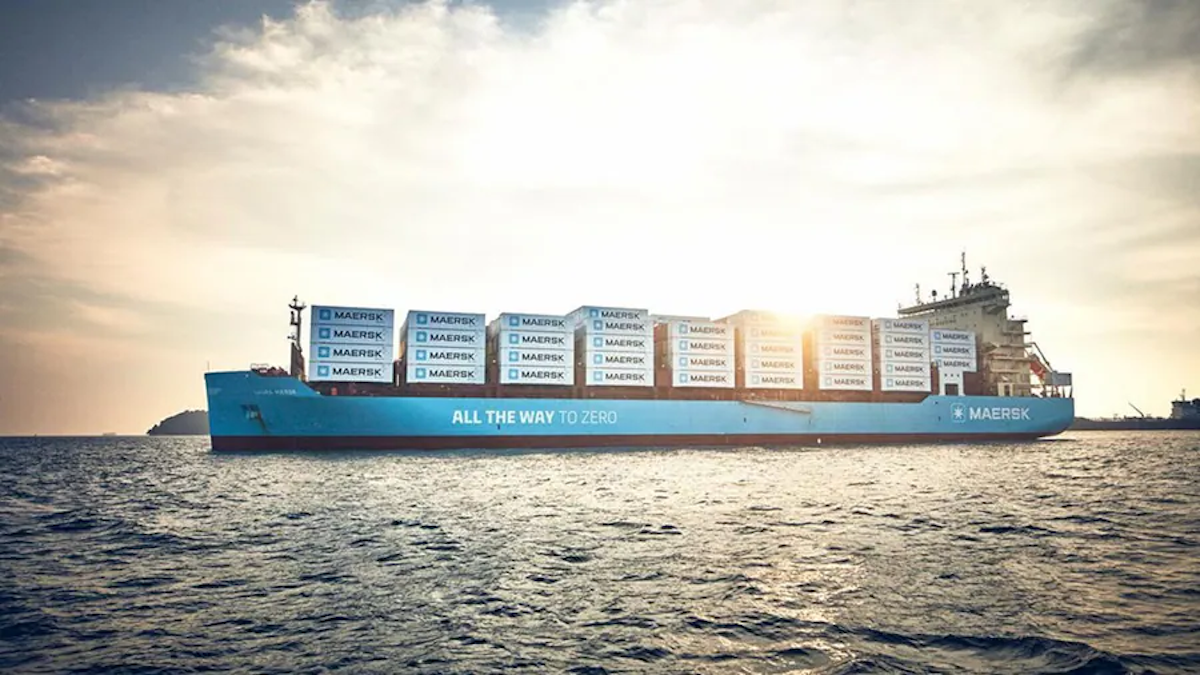 A Maersk methanol-powered ship carries cargo in the ocean.
