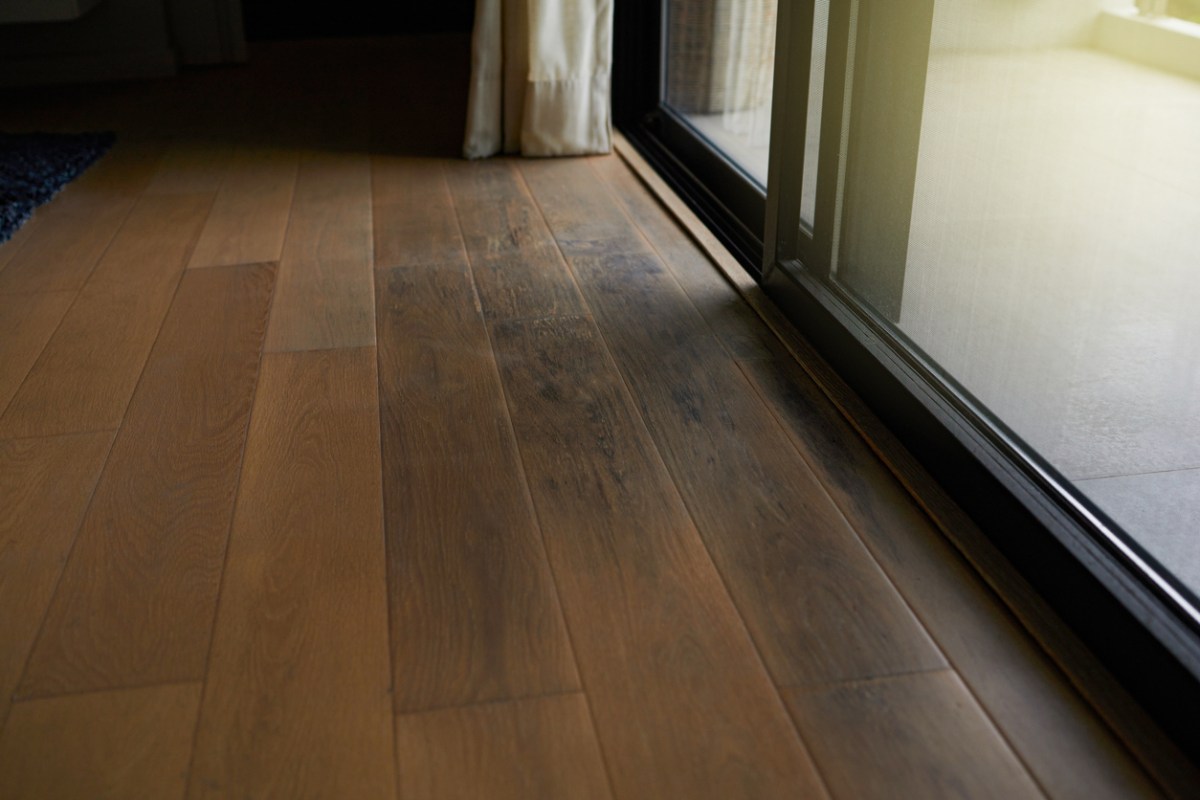 A close up of brown flooring.