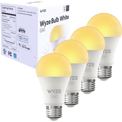 Four of the Wyze 800 Lumen 90+ CRI Smart LED Light Bulbs and their box lit up on a white background.