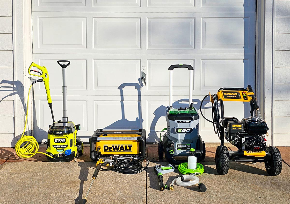 A group of the best pressure washers in a driveway before testing.
