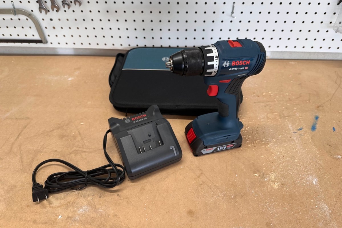 The Bosch 18V Compact Brushless ½-Inch Drill/Driver Kit on a workbench.