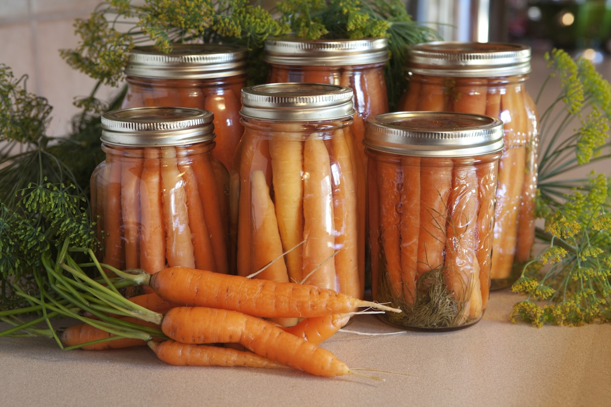 Canned carrots on countertop.