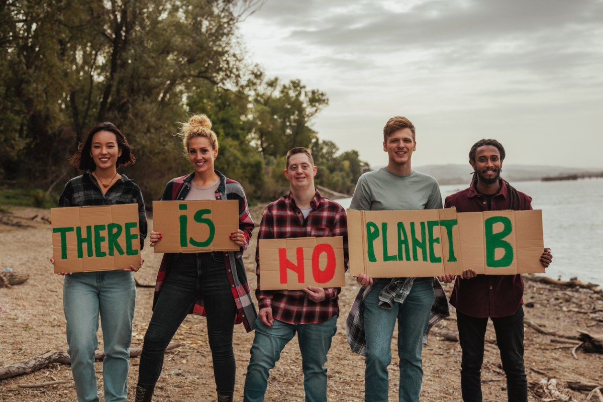 A-diverse-group-of-young-people-hold-signs-that-read-There-is-no-planet-B.