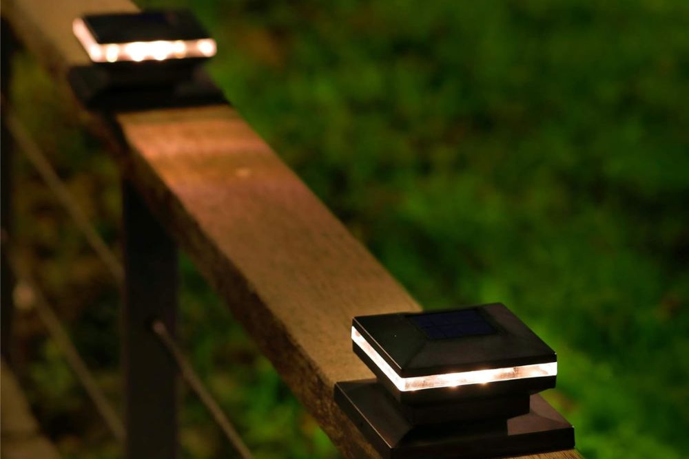 The best solar fence lights installed along a wood railing.