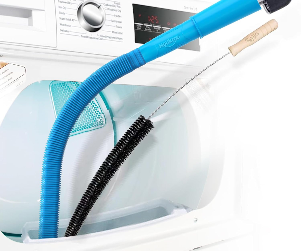 A dryer vent cleaning brush and vacuum attachment are being used simultaneously to clean a dryer vent.