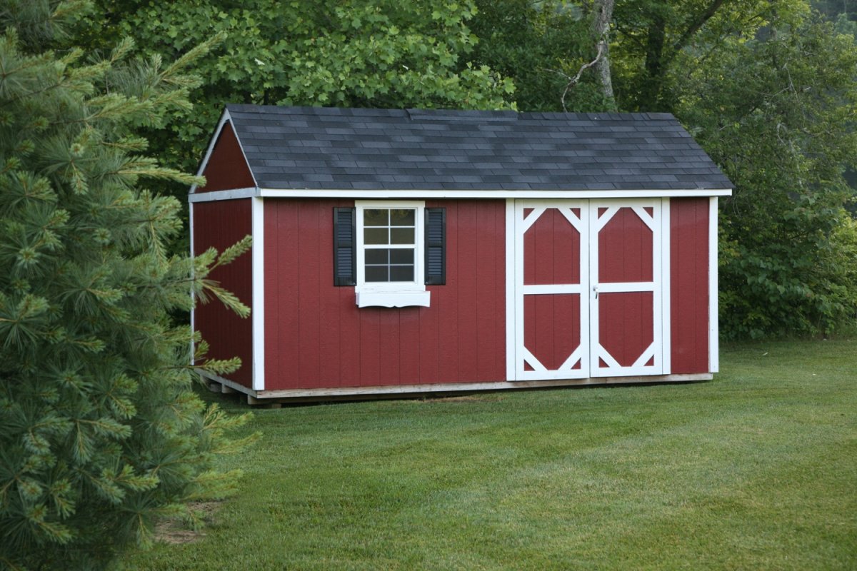 A red shed against a verdant backdrop.