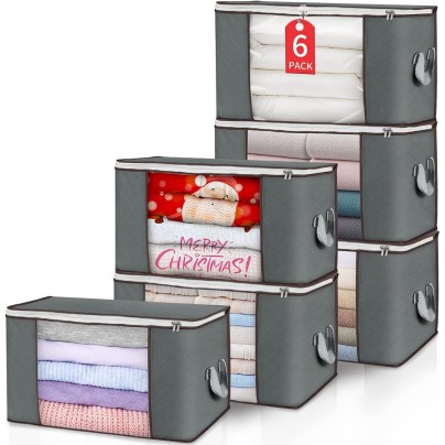 The Budding Joy 6-Pack Foldable Clothes Storage Bags filled with clothing on a white background.