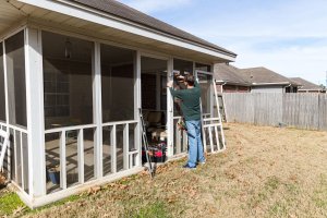 A view of a worker installing a new patio door.