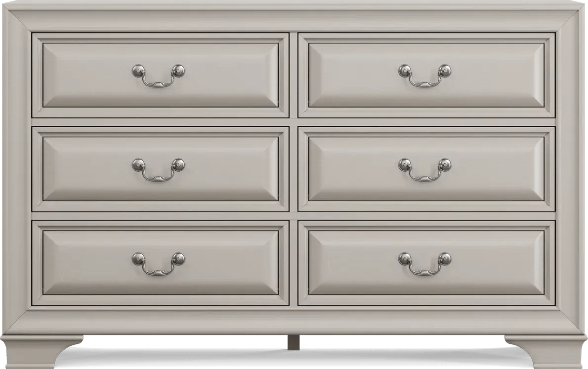 An off white dresser is against a white background.