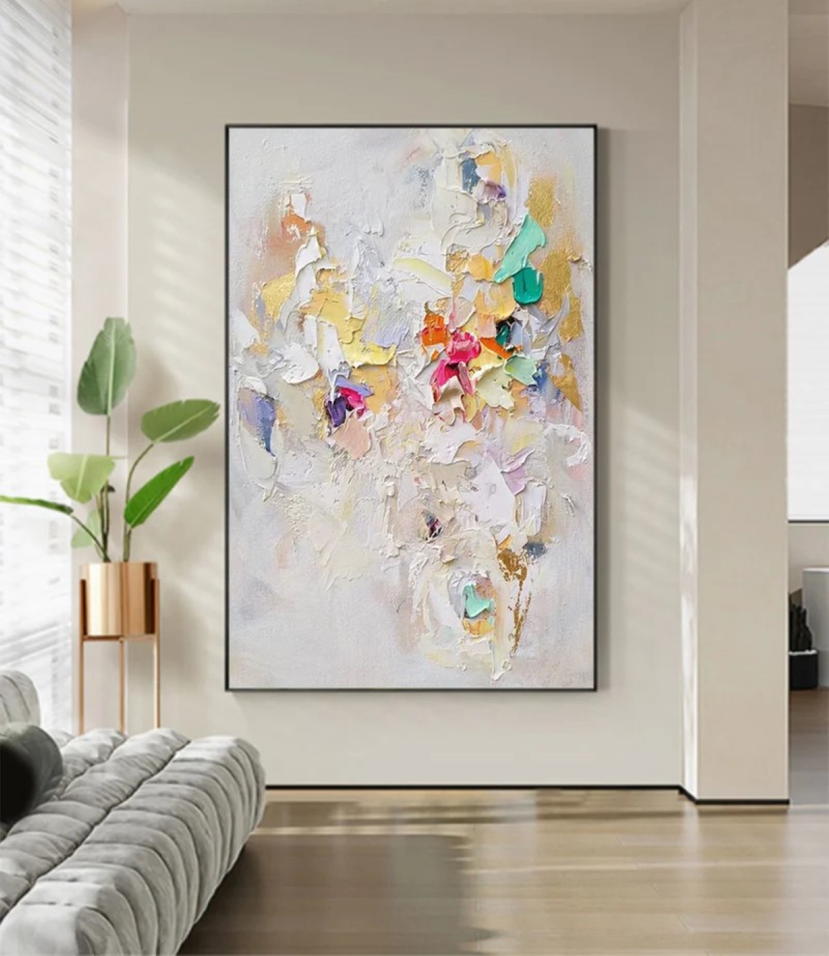 Large vertical piece of art on living room wall.