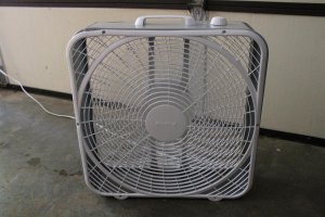 Air King Commercial-Grade Box Fan on concrete garage floor