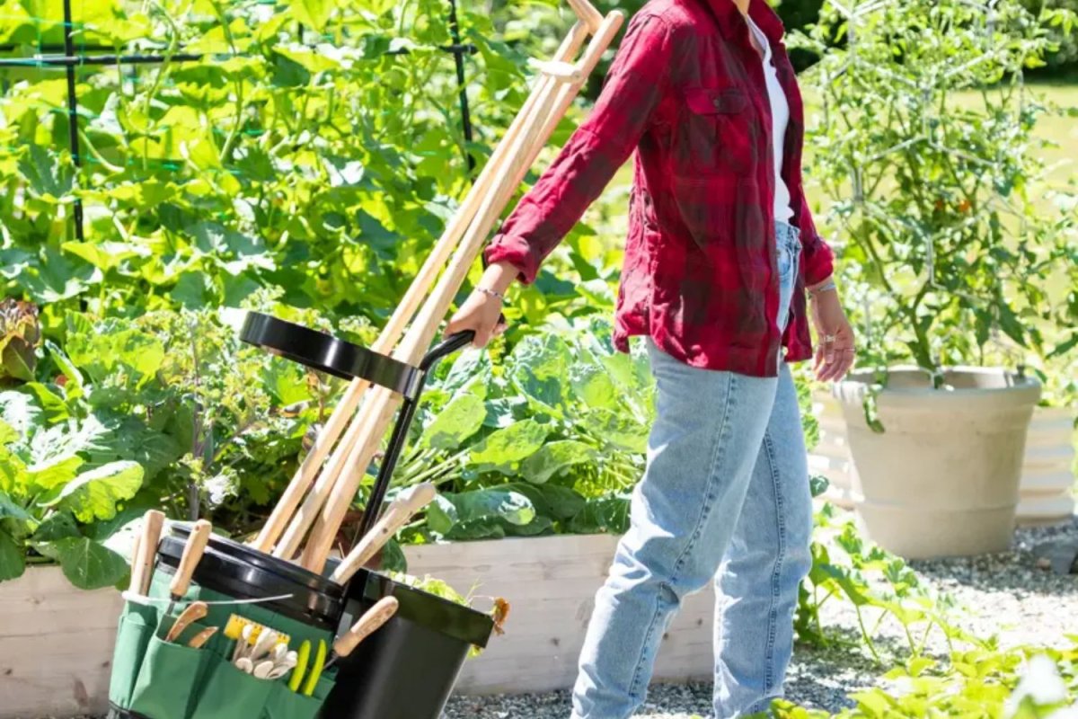 a man using Mobile Tool Storage Caddy in a garden