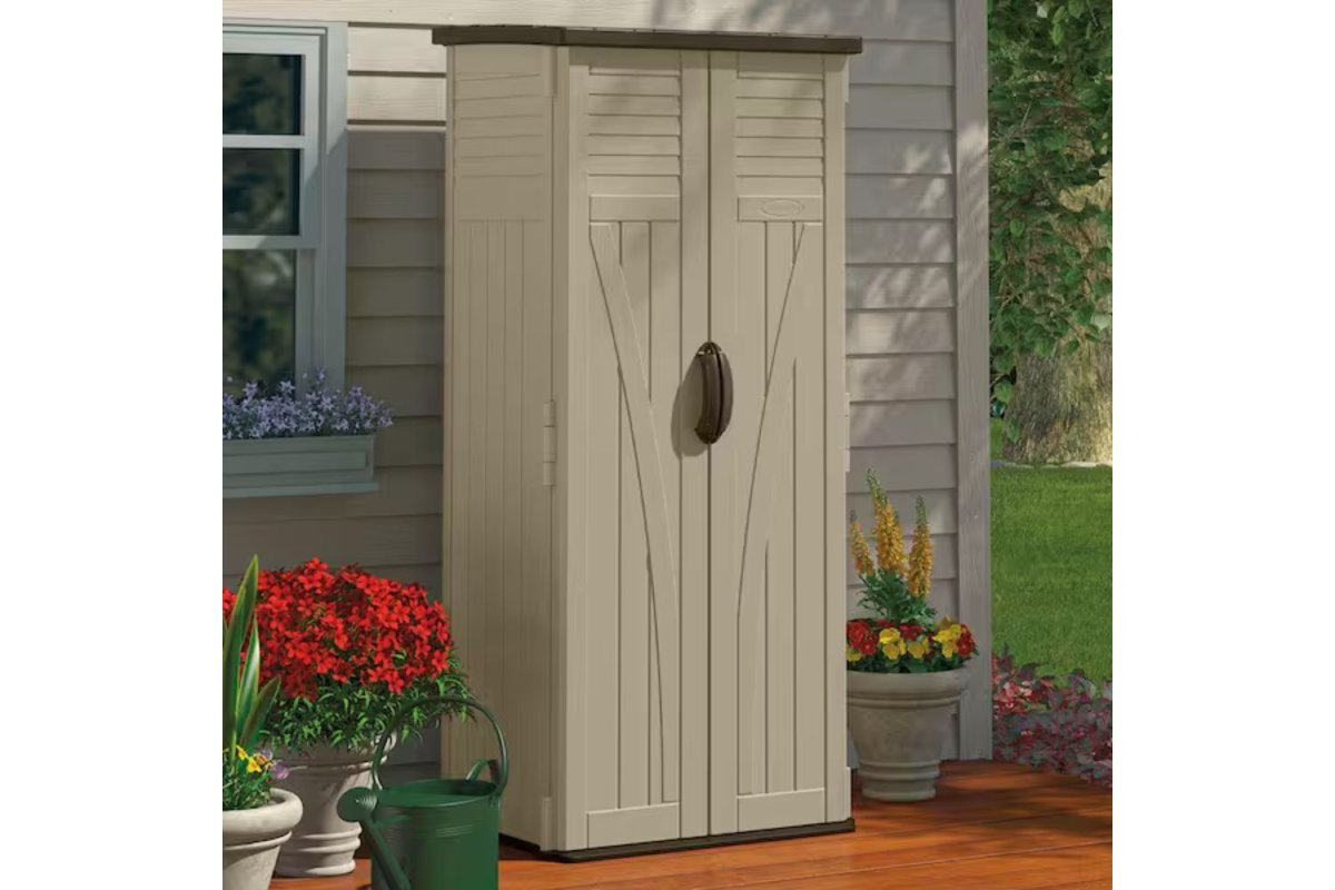 Suncast Resin Vertical Storage Shed set up in a garden