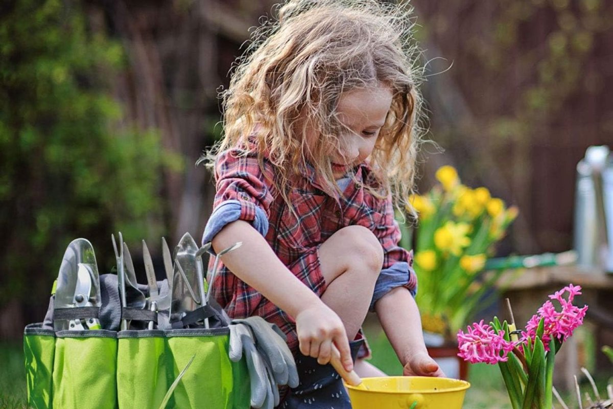 Workpro Garden Tool Bag used by a little girl planting flowers