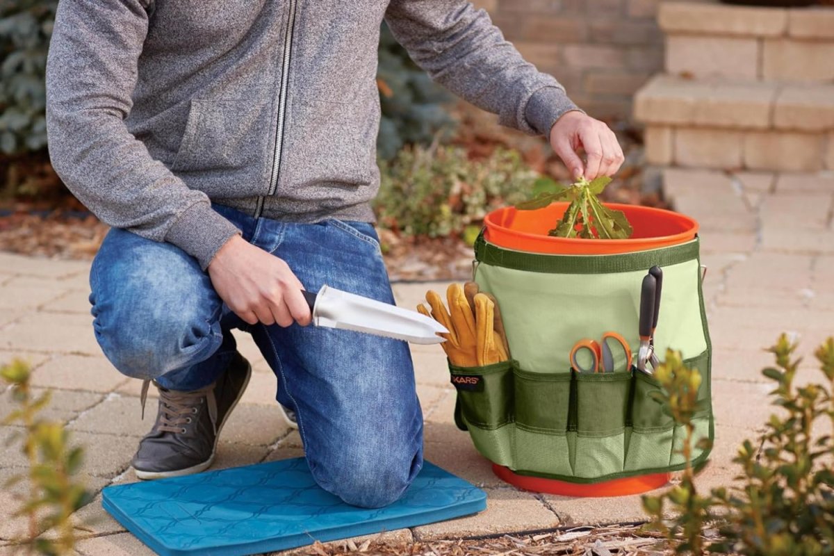 a man working and using Fiskars Garden Tool Bucket Caddy