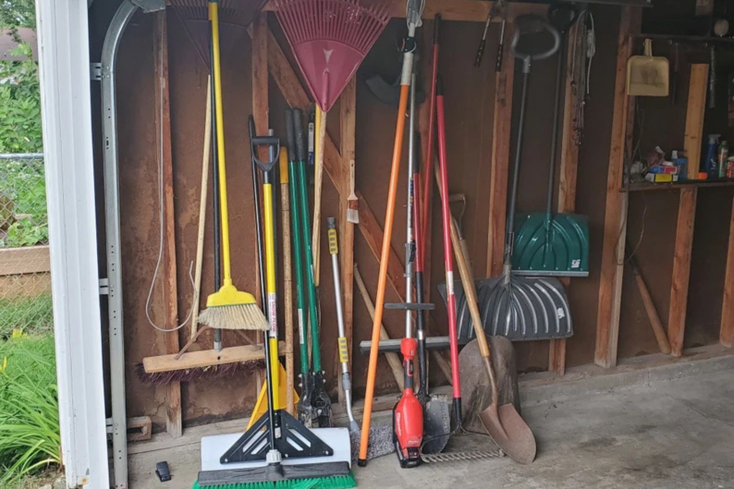 Garden Tool Rack in a garage with lots of tools for the garden