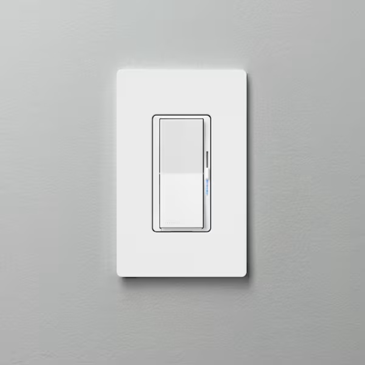Dimmer switch on gray wall.