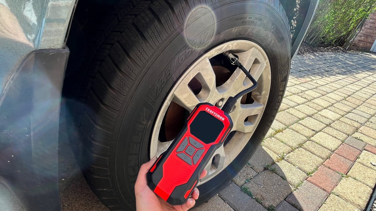 Craftsman Mini Inflator + Powerbank inflating a car tire
