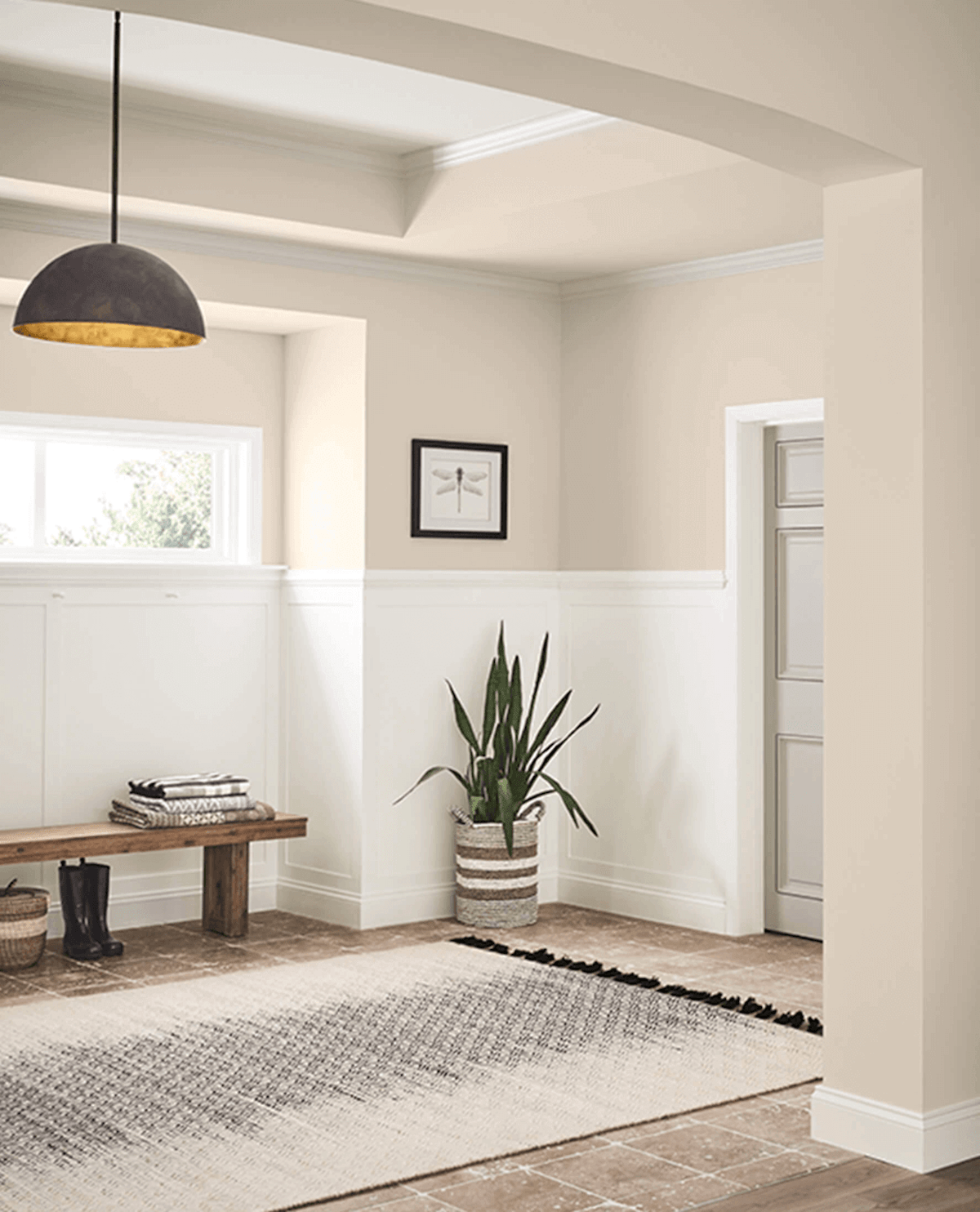 Sherwin-Williams Natural Linen neutral paint color on entryway walls.