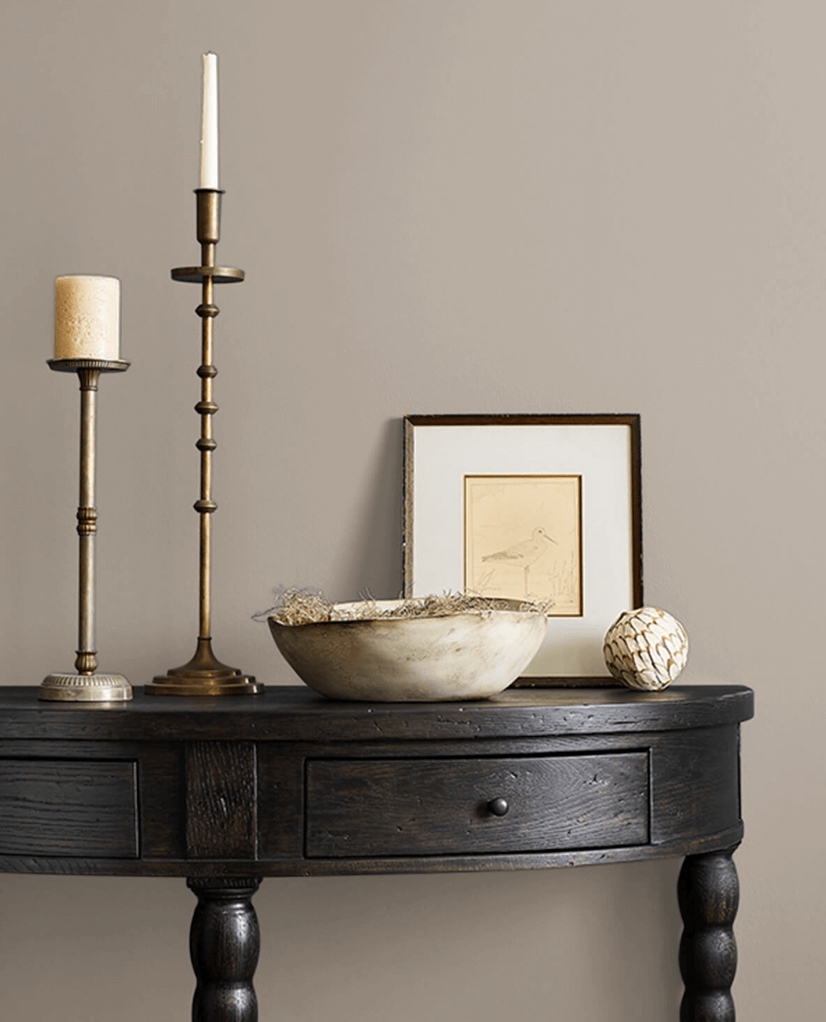 Sherwin-Williams neutral paint color called restoration on a hallway wall.