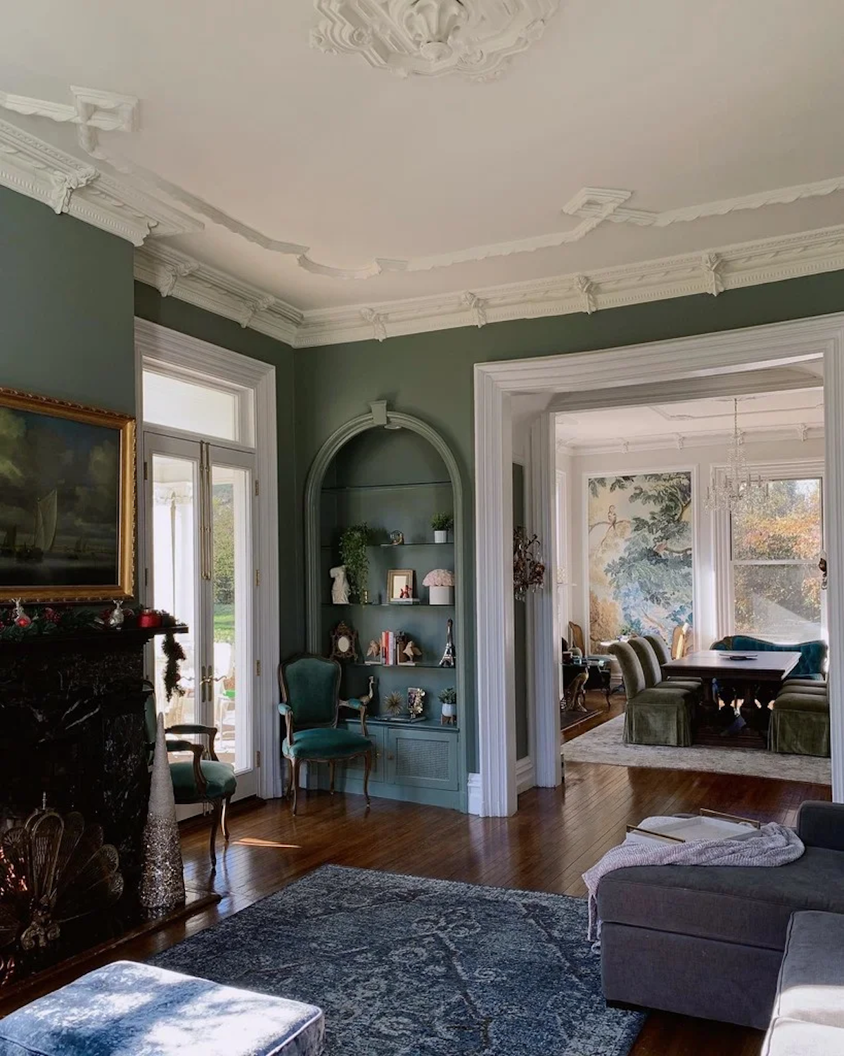 A living room painted in Green Smoke from Farrow &amp; Ball, one of the best green paint colors.