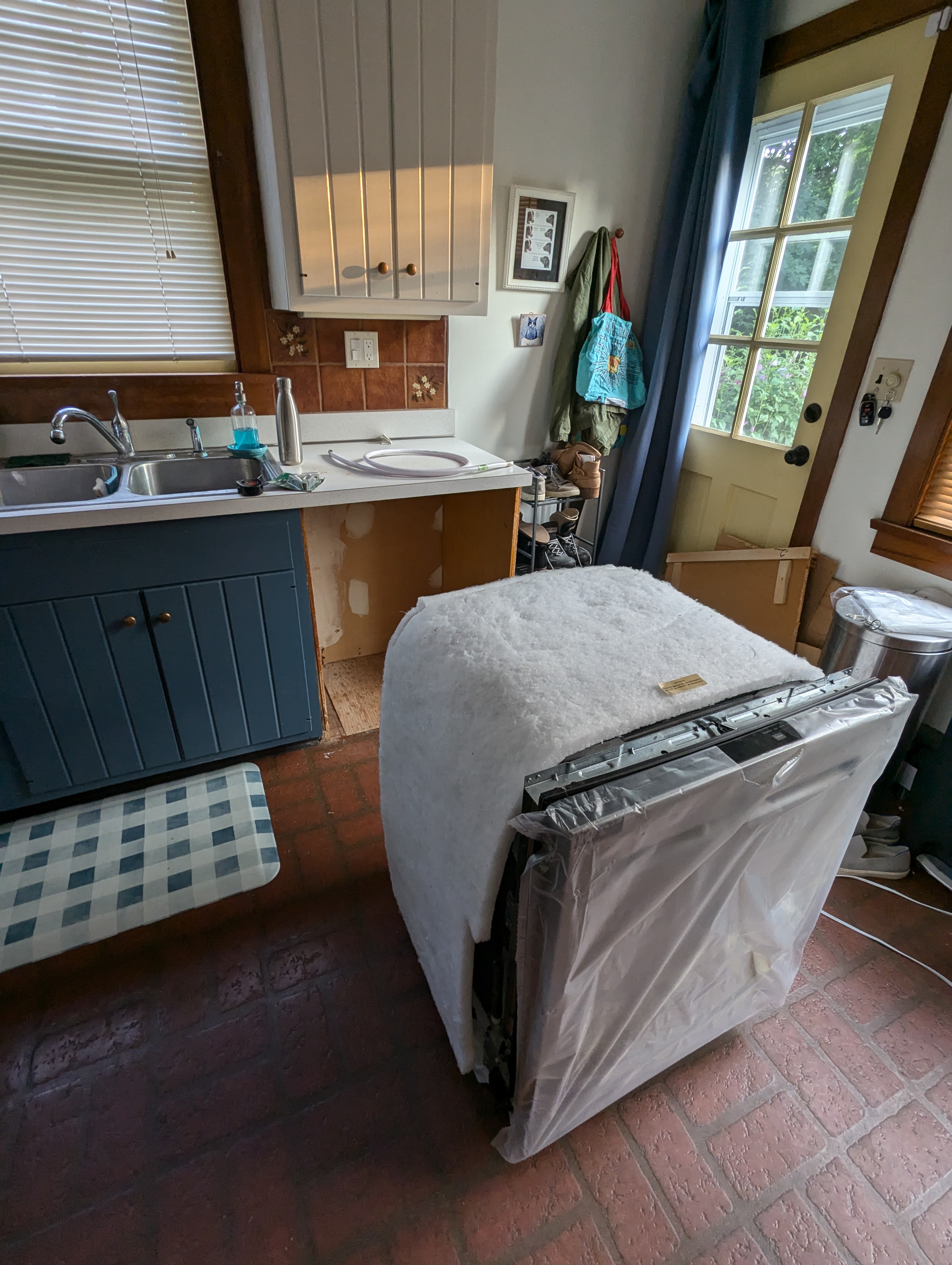 After painting the cabinets in my kitchen's "slow reno," I installed a dishwasher