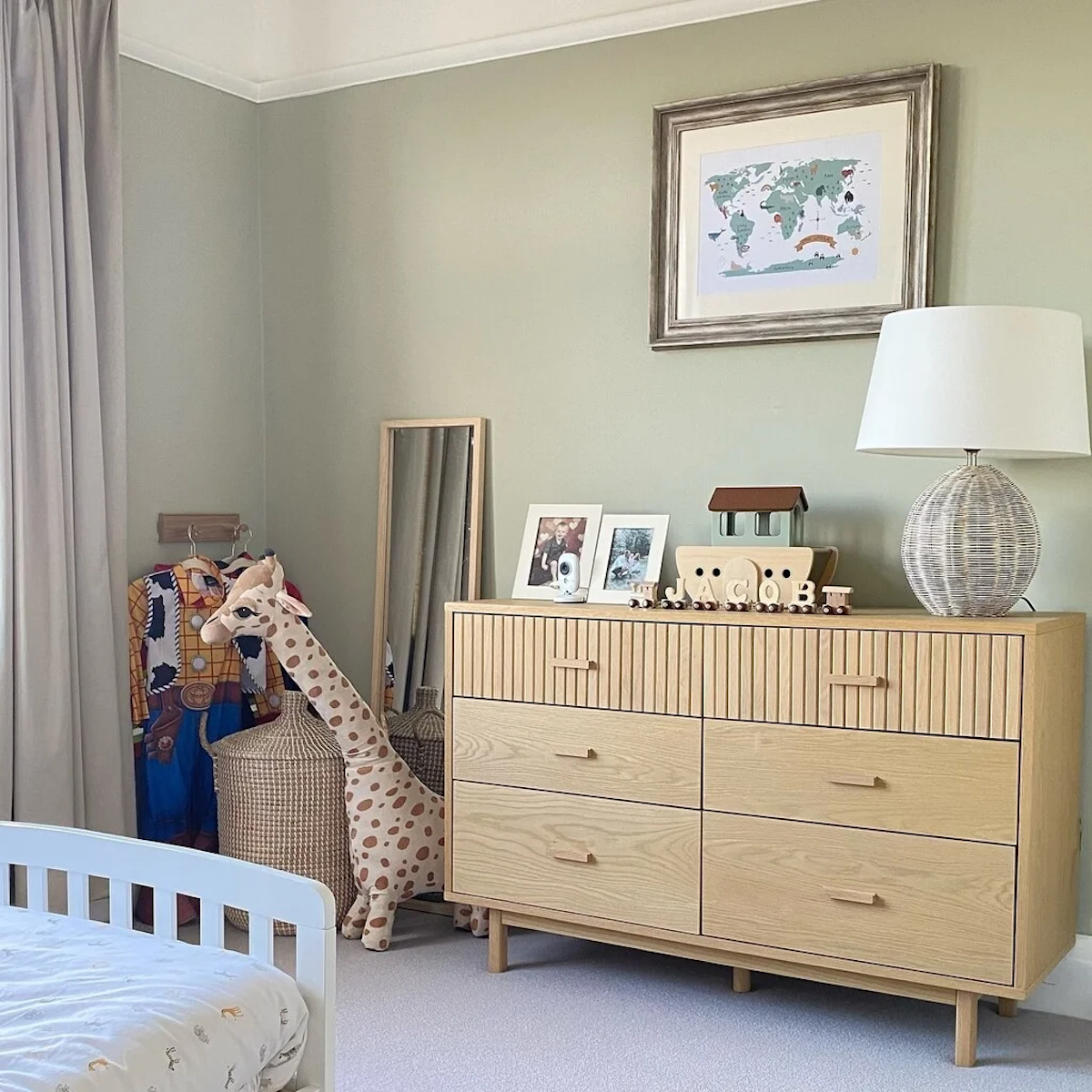 A nursery painted in Mizzle, one of the best green paint colors from Farrow & Ball.