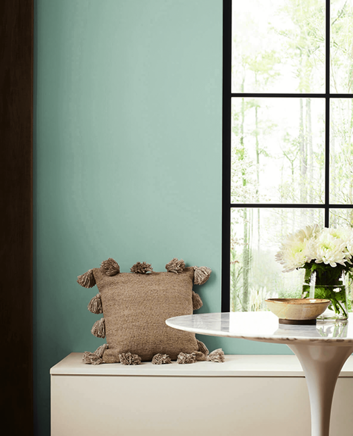 Sherwin-Williams' Hazel, one of the best green paint colors of 2025, painted on an interior wall.