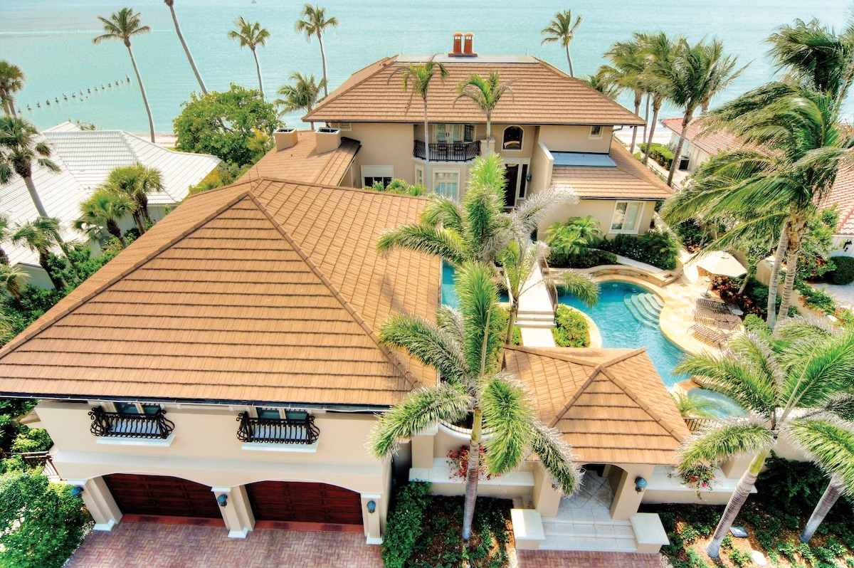 A coastal home featuring a beautiful and durable metal roof.