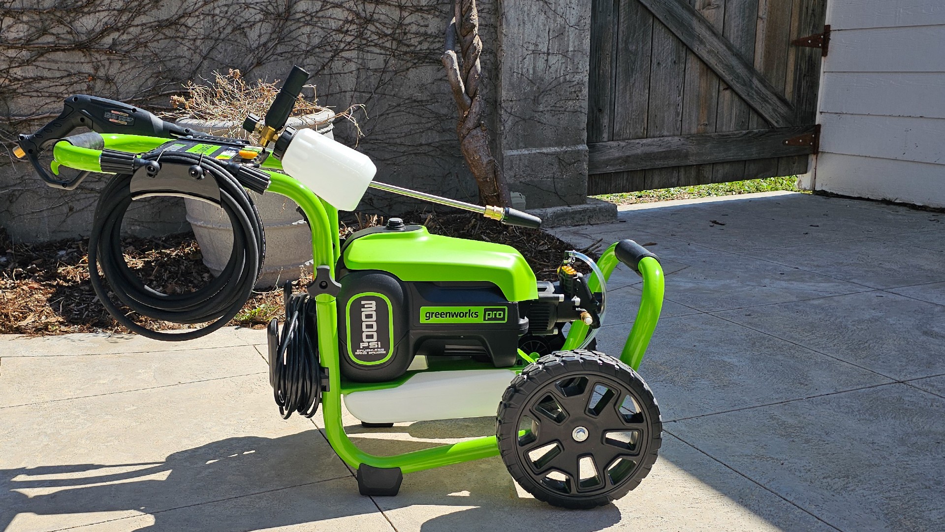 Pressure washer with hose and cord stored