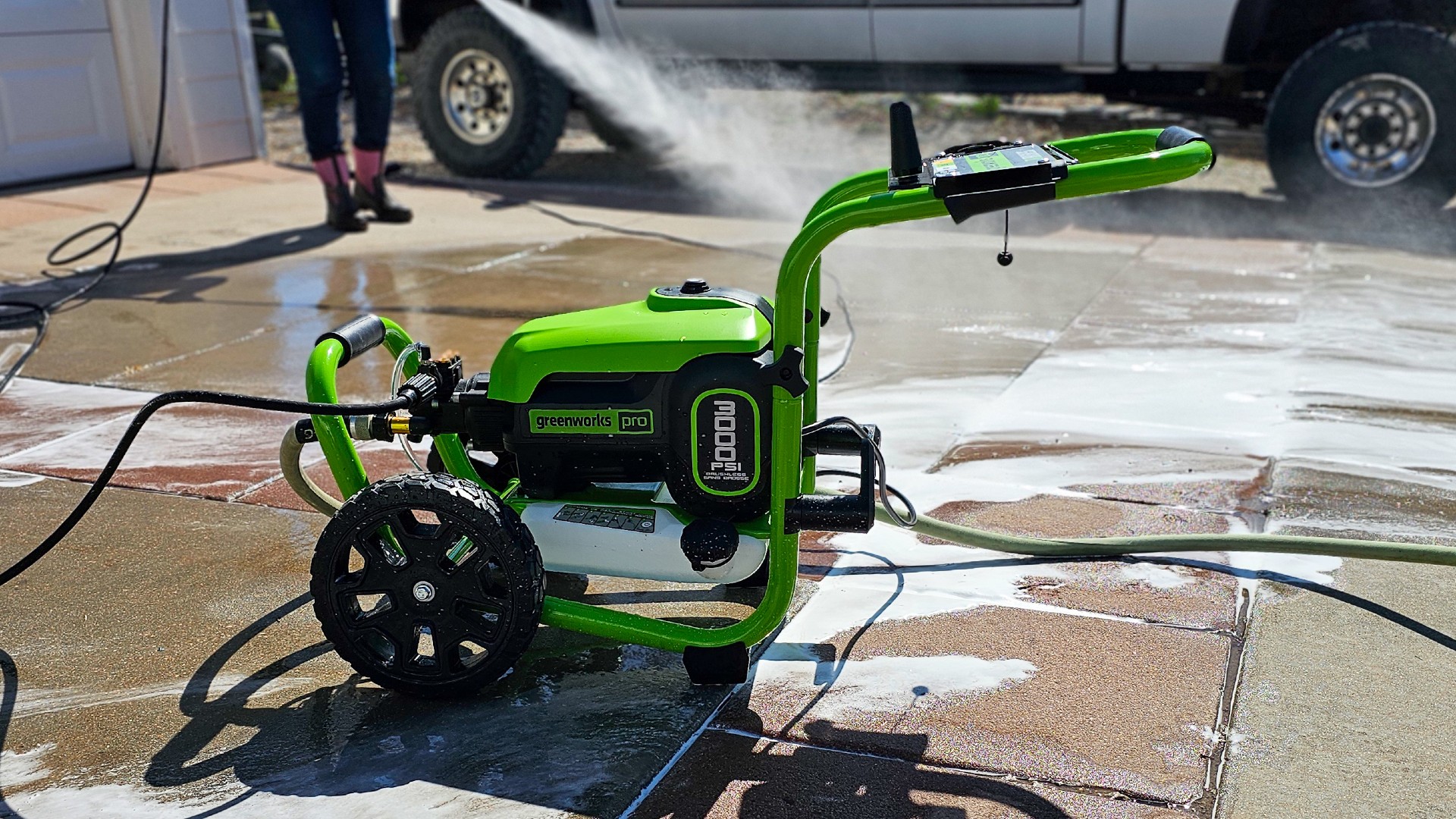 Spraying and cleaning driveway