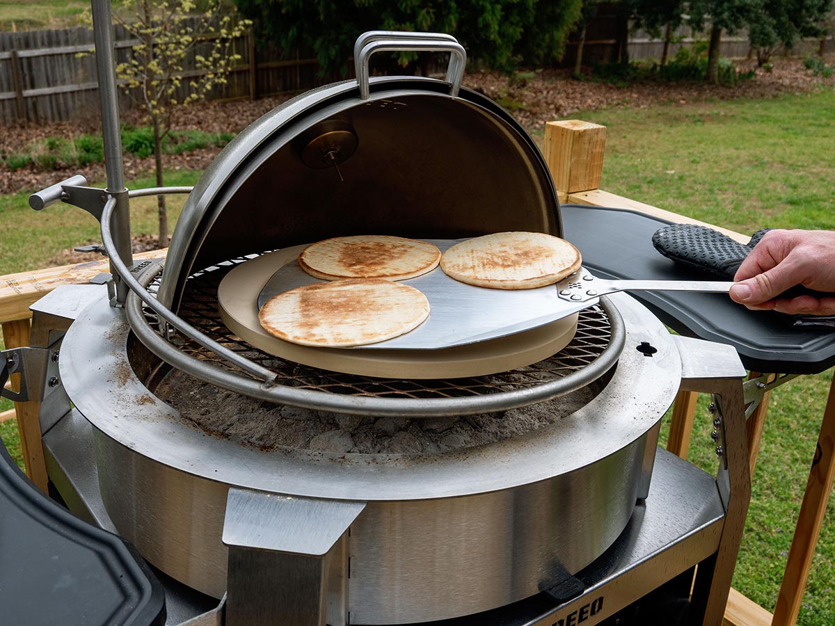 Breeo Grill Dome pizza stone action
