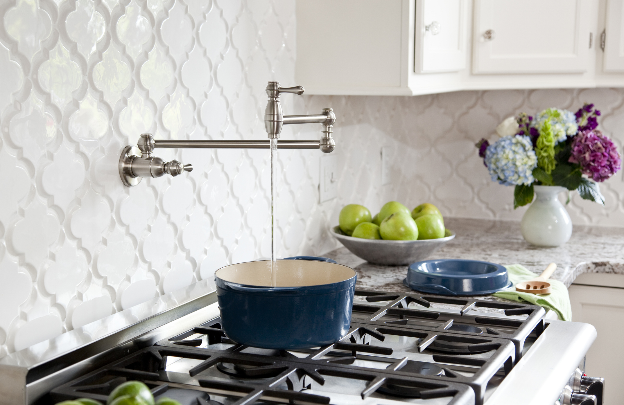 Pot-Filler faucet on stove in kitchen