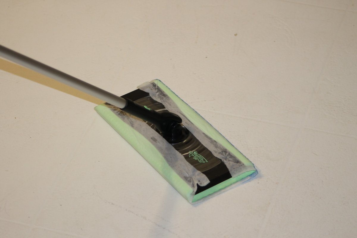Mopping floor with Swiffer Deluxe