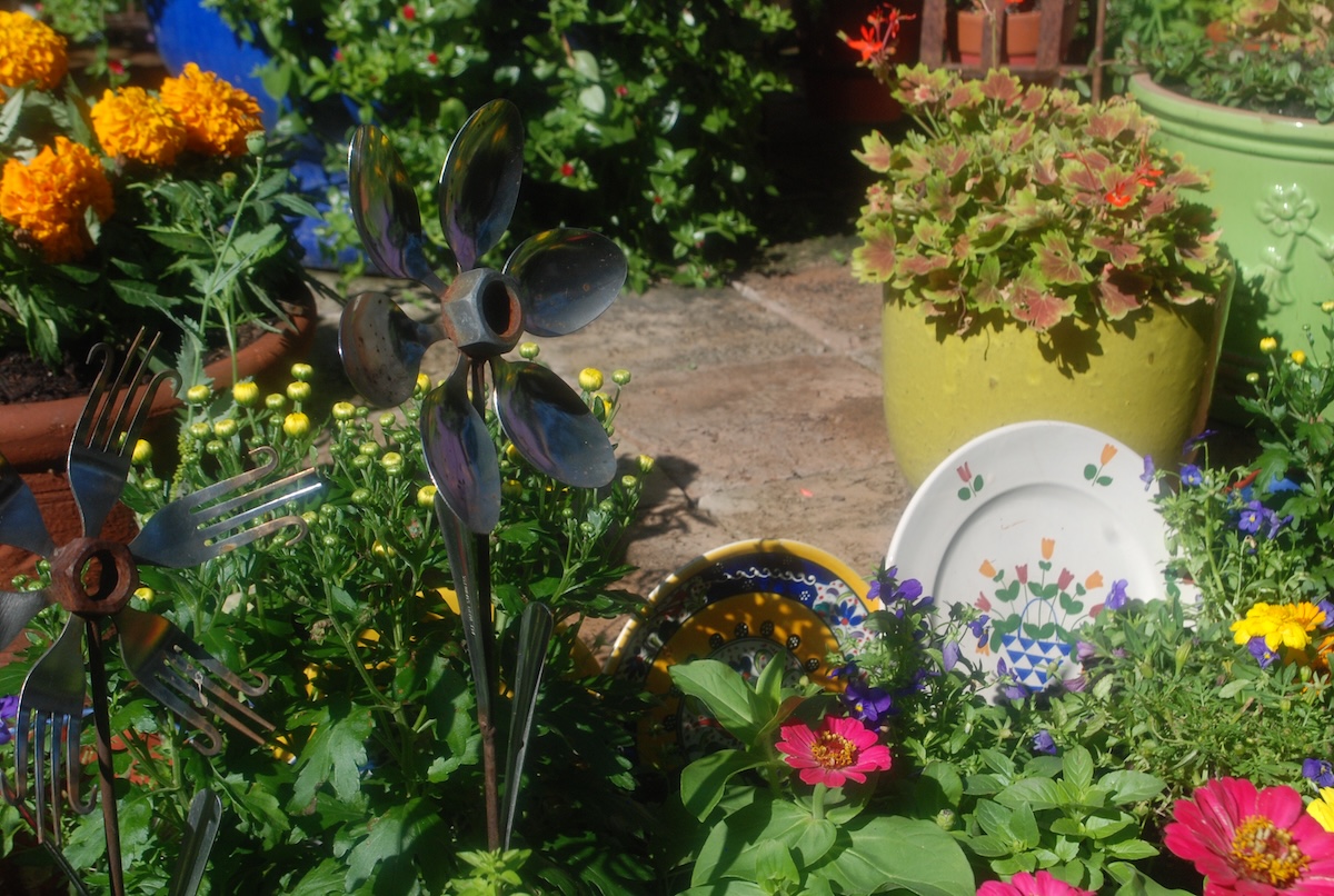 Colorful garden decor in a sunny garden plot.
