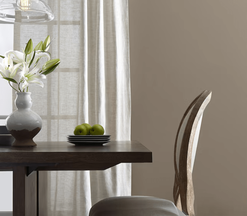 Safari Beige paint color from Valspar on a dining room wall.