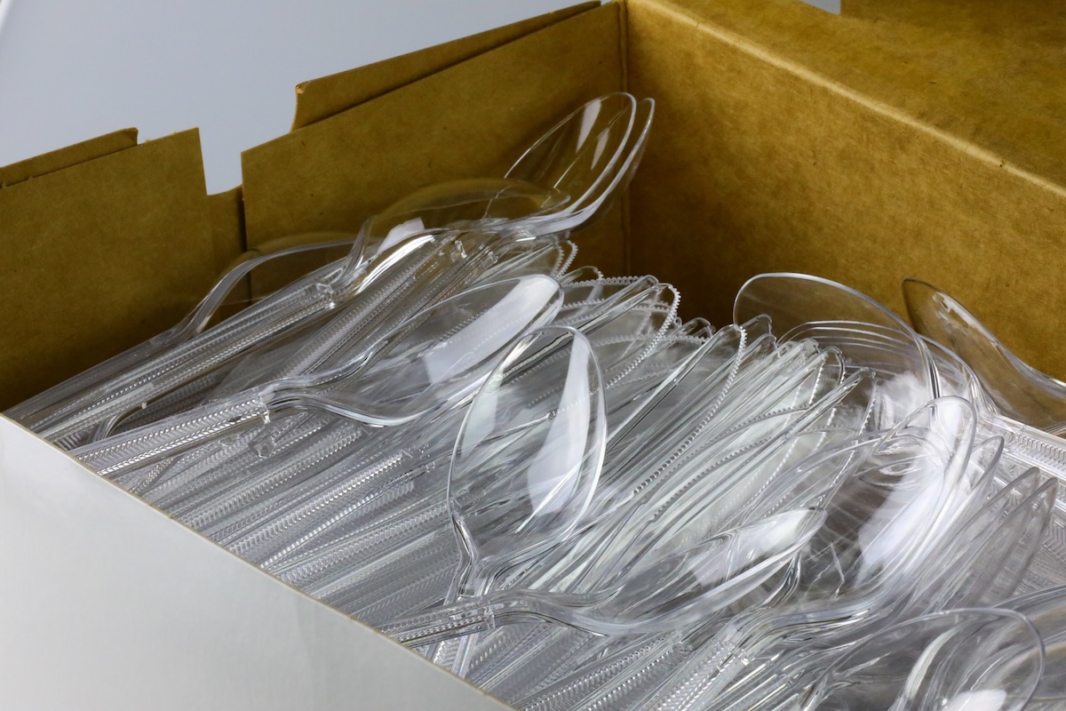 Plastic forks in a box.