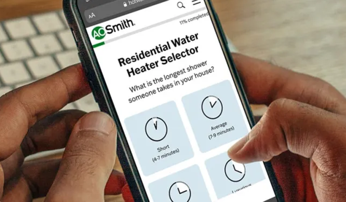A homeowner answering questions on an app to determine the best water heater to buy.
