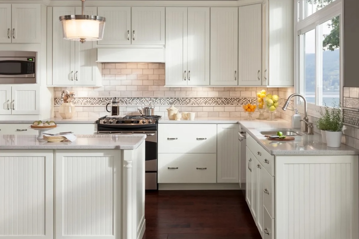Kitchen with white beadboard cabinets.