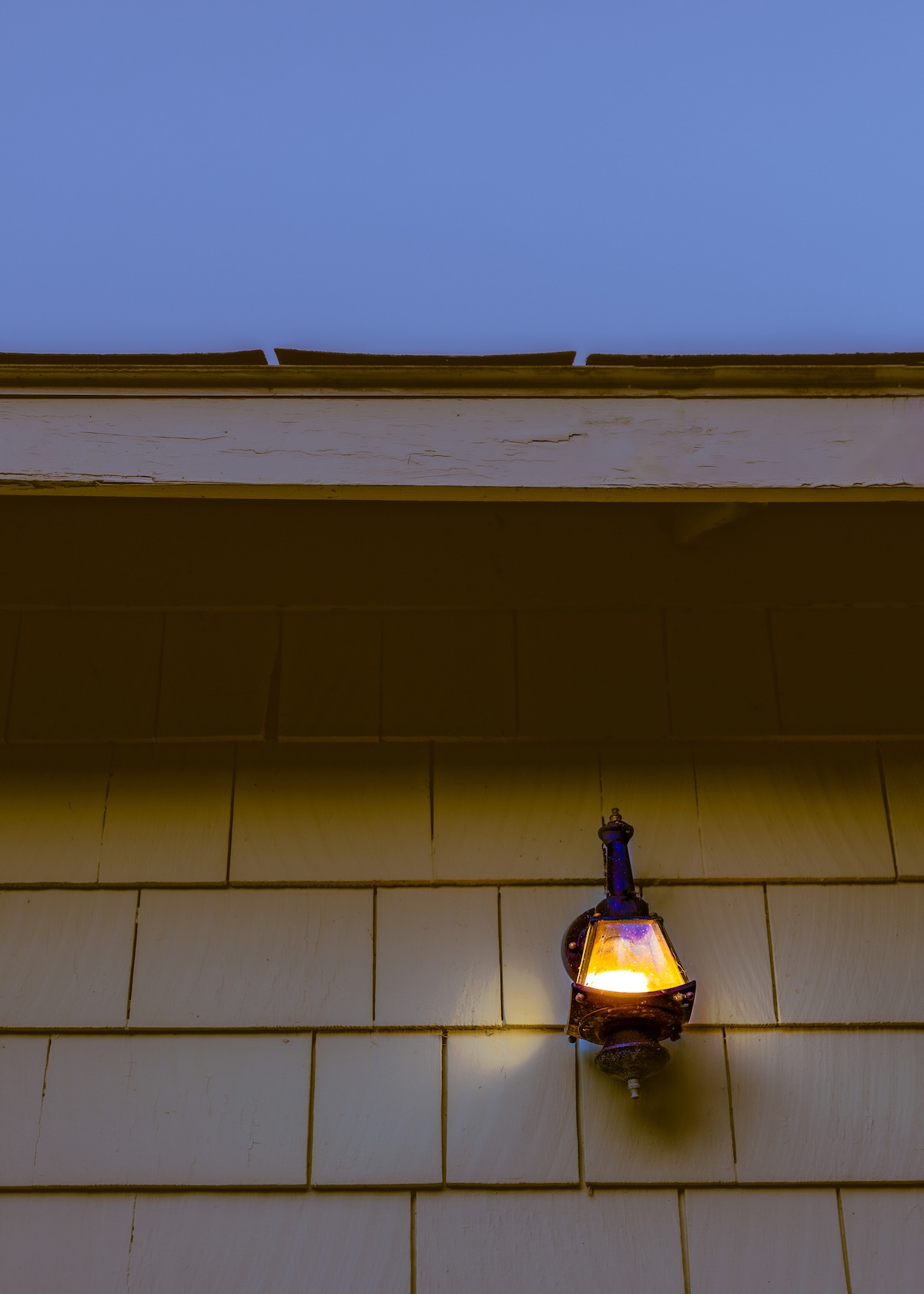 An outdoor light fixture installed upside down.