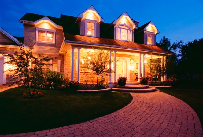 A home with excessive outdoor lighting at night.