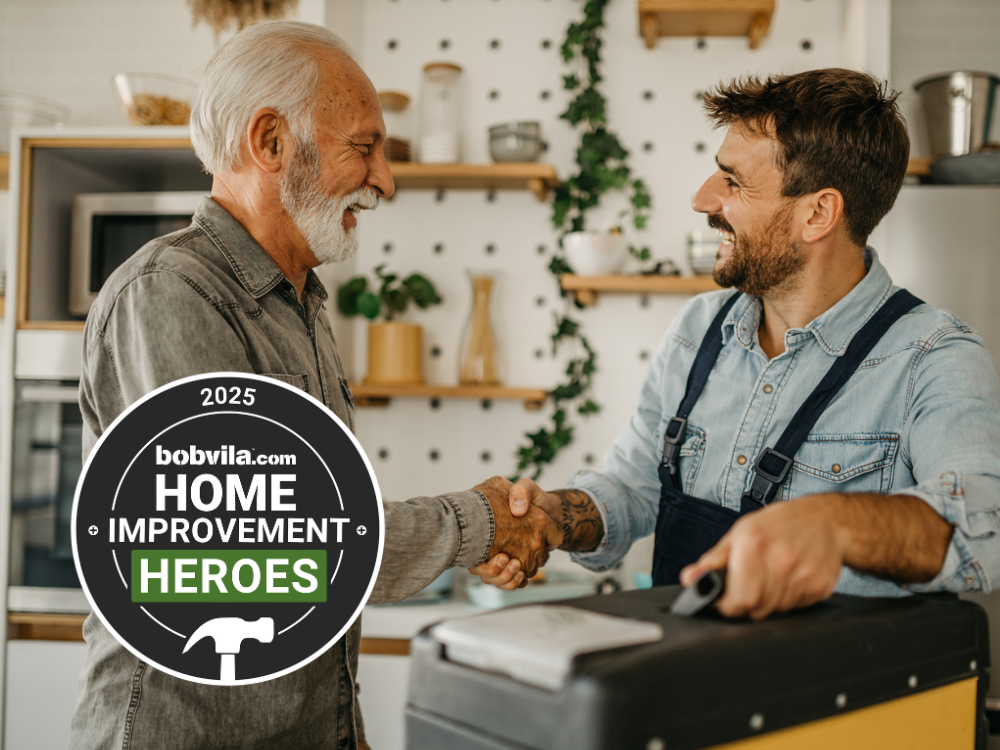 Trusted contractor in the kitchen shaking hands with a homeowner