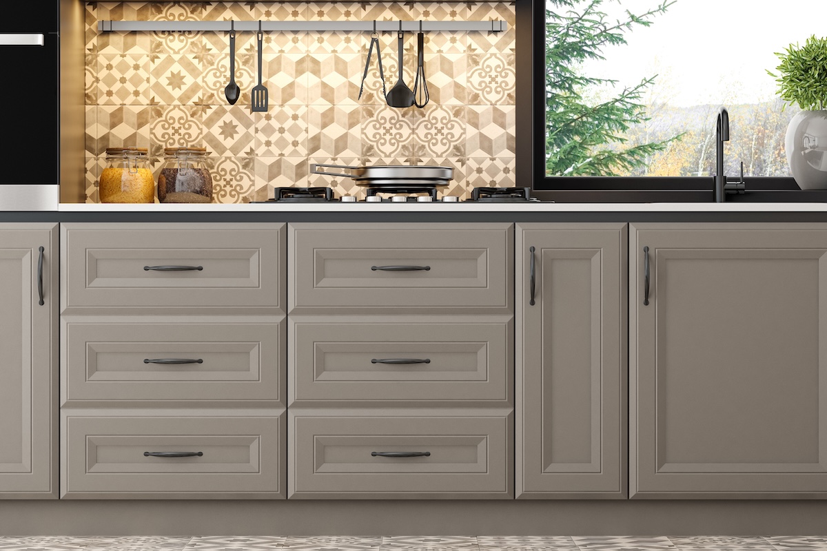 This elegant Scandinavian kitchen blends classic design with warm beige tones and Moroccan-inspired tiles, creating a sophisticated and inviting atmosphere. The space features sleek cabinetry, open shelving, and a cozy beige dining area, all enhanced by the unique Moroccan tile accents in earthy beige and brown. The serene winter landscape outside adds a touch of tranquility, perfect for showcasing both timeless kitchen design and the warmth of modern Scandinavian style. Ideal for interior design studios, appliance manufa