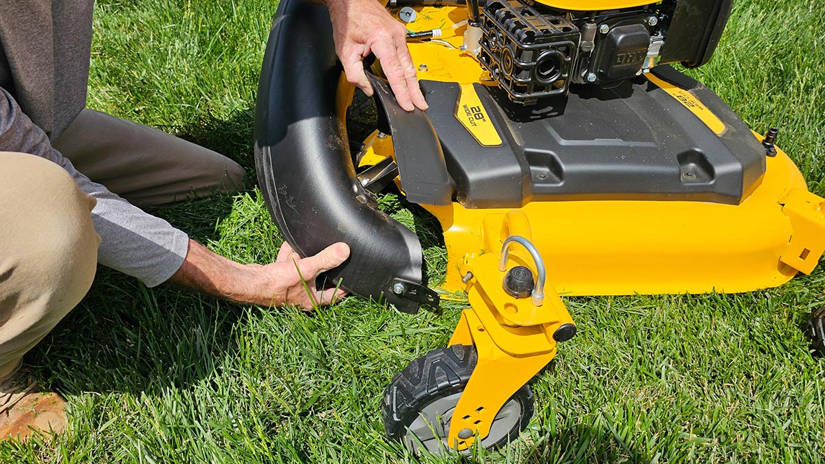 DeWalt Gas Lawn Mower Review Attaching the chute for bagging clippings