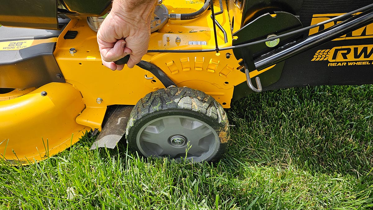 DeWalt Gas Lawn Mower Review One-hand cutting height adjustment on the DeWalt mower