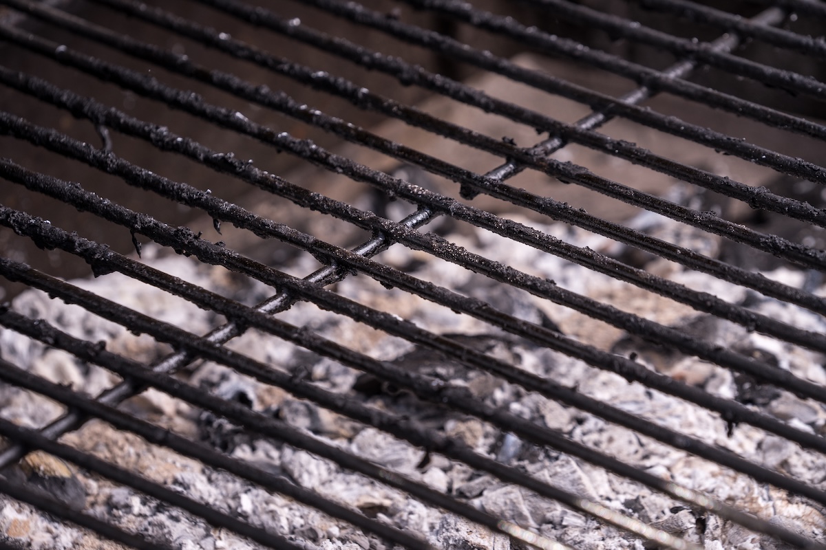 A dirty grill grate that needs to be deep cleaned.
